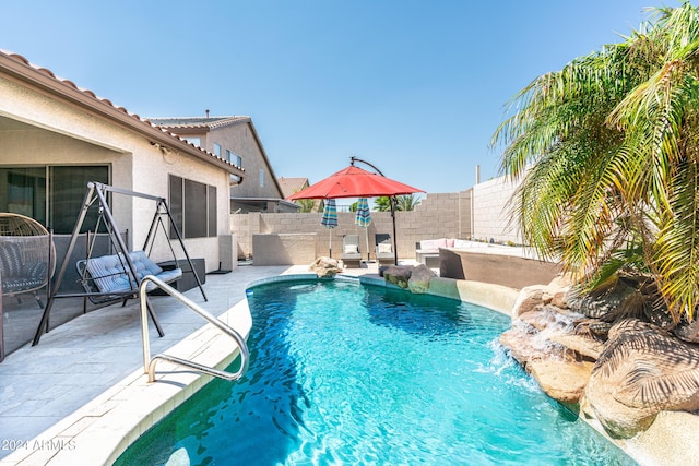 view of pool with a patio area, a fenced in pool, and a fenced backyard