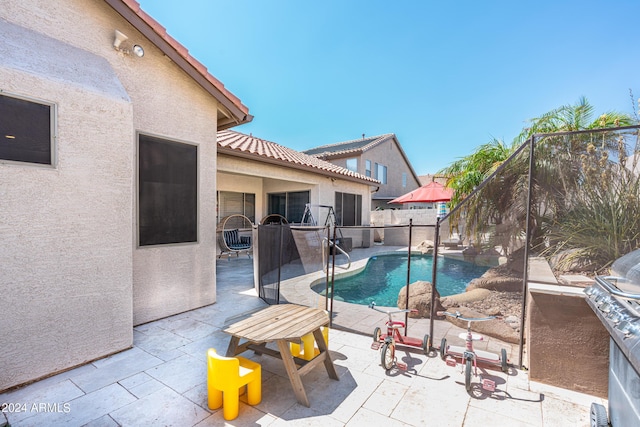 view of swimming pool with a fenced in pool, a patio, and a fenced backyard