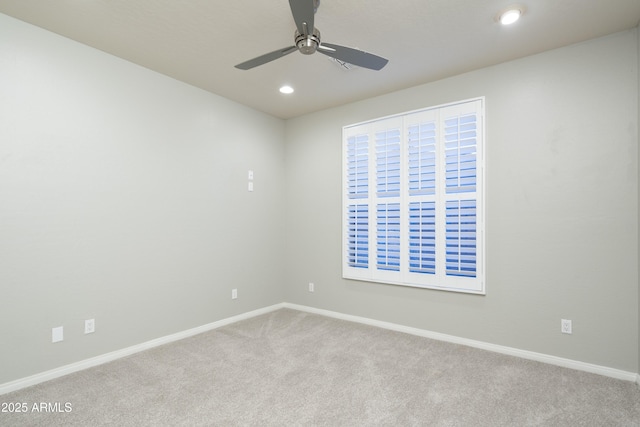 spare room featuring baseboards, carpet floors, recessed lighting, and a ceiling fan
