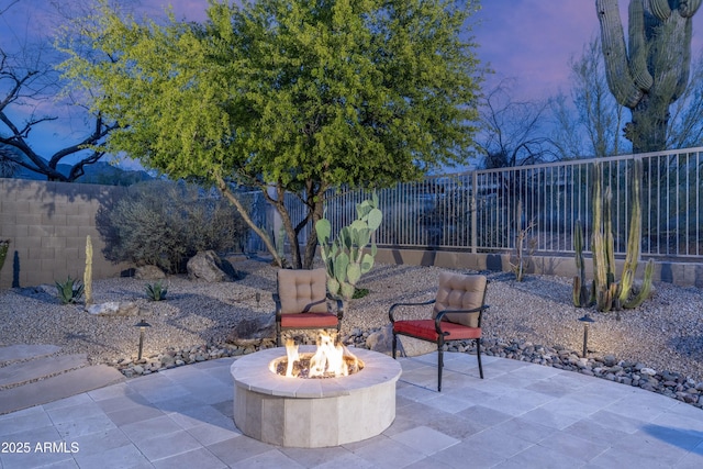 view of patio with a fire pit and a fenced backyard