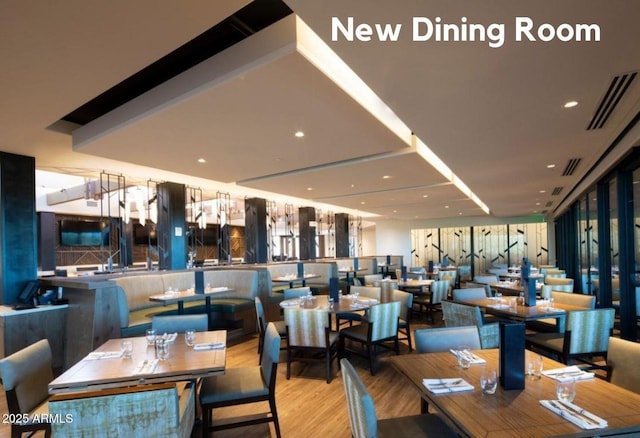 dining space featuring visible vents, wood finished floors, and recessed lighting