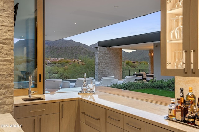 interior space featuring a mountain view and sink