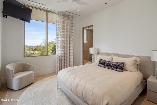 bedroom with light hardwood / wood-style floors and ceiling fan