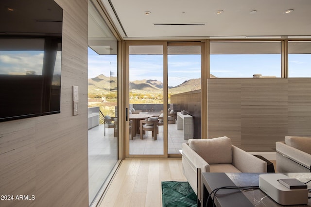 sunroom with a mountain view