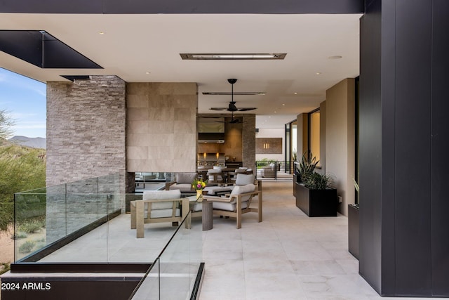 view of patio featuring ceiling fan and an outdoor hangout area