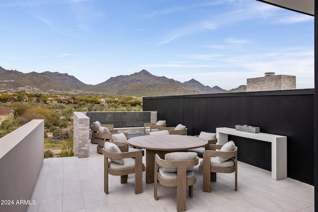 view of patio / terrace with a mountain view