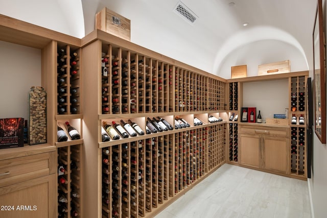 wine area with lofted ceiling