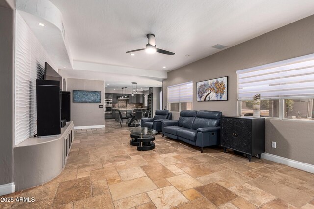 1751 W Mulberry Dr, Chandler, AZ 85286 - living room featuring ceiling fan and stone tile flooring