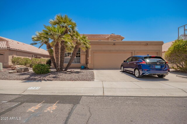 1751 W Mulberry Dr, Chandler, AZ 85286 - view of front of home with a garage, stucco siding, concrete driveway, and a tiled roof