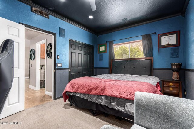 1751 W Mulberry Dr, Chandler, AZ 85286 - bedroom with a closet, ornamental molding, a textured wall, ceiling fan, and a textured ceiling
