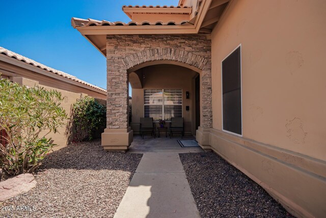 1751 W Mulberry Dr, Chandler, AZ 85286 - property entrance featuring stucco siding, stone siding, and a tile roof