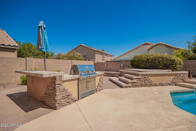 1751 W Mulberry Dr, Chandler, AZ 85286 - fenced backyard with exterior kitchen and a patio