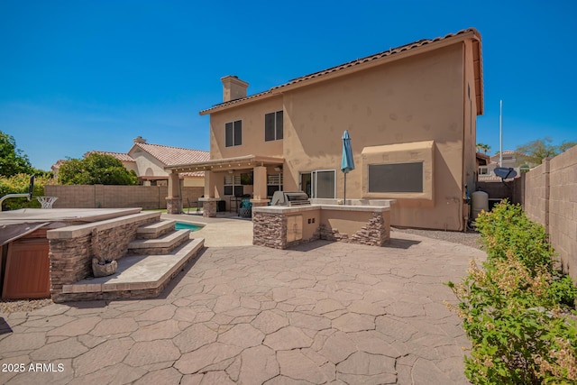 1751 W Mulberry Dr, Chandler, AZ 85286 - back of house featuring a chimney, area for grilling, stucco siding, a patio, and a fenced backyard