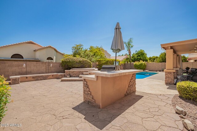 1751 W Mulberry Dr, Chandler, AZ 85286 - fenced backyard featuring a patio, area for grilling, and a ceiling fan