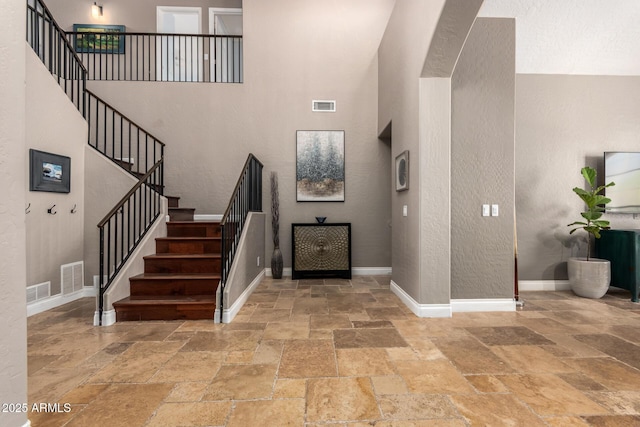 1751 W Mulberry Dr, Chandler, AZ 85286 - entrance foyer featuring stone tile flooring, a towering ceiling, and stairs
