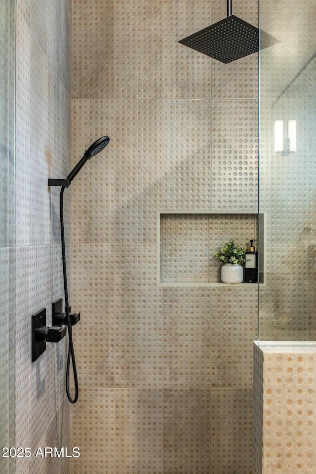 interior space featuring tiled shower