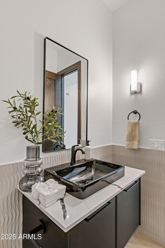 bathroom featuring vanity and wood finished floors