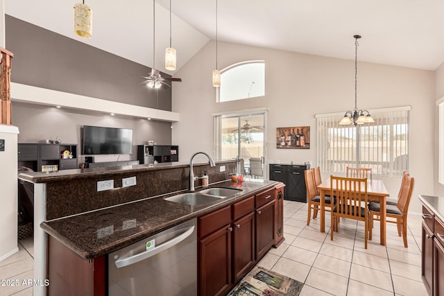 kitchen with dishwasher, hanging light fixtures, ceiling fan with notable chandelier, and a sink