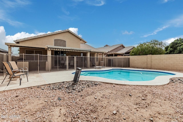 view of pool with a patio area, a fenced backyard, and a fenced in pool