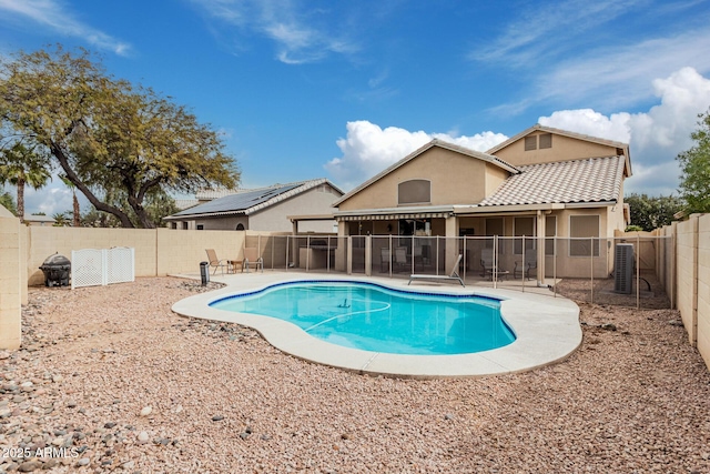 view of swimming pool featuring a patio area, a fenced backyard, and a fenced in pool