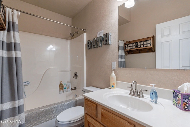 full bathroom featuring shower / bath combination with curtain, toilet, and vanity