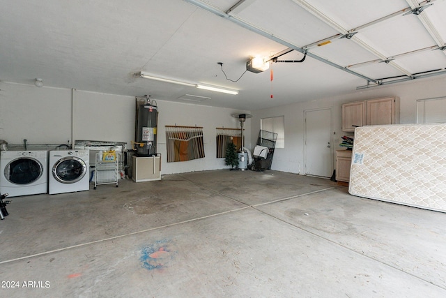 garage with washer and dryer and gas water heater