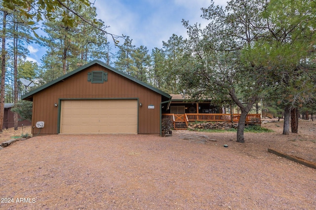 view of front of home featuring a deck and a garage