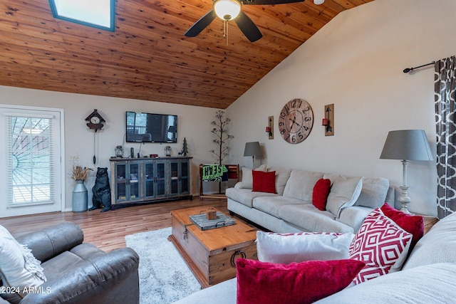 living room featuring vaulted ceiling, light hardwood / wood-style floors, wooden ceiling, and ceiling fan