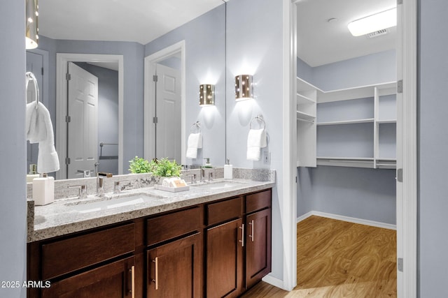 16210 E Links Dr, Fountain Hills, AZ 85268 - full bath featuring a sink, baseboards, double vanity, and wood finished floors