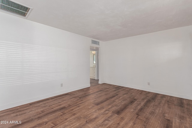 unfurnished room featuring wood-type flooring