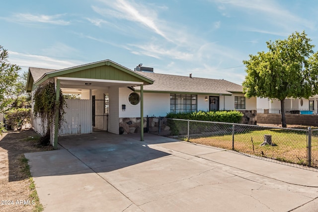 single story home with a carport