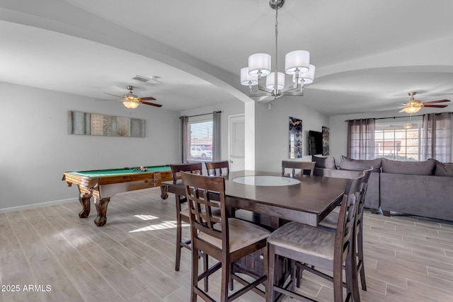 dining area with light wood-type flooring, ceiling fan with notable chandelier, and billiards