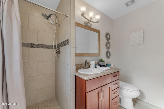 bathroom with a shower with shower curtain, vanity, and toilet