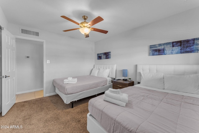 bedroom with ceiling fan and carpet