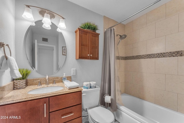 full bathroom featuring vanity, toilet, and shower / tub combo with curtain