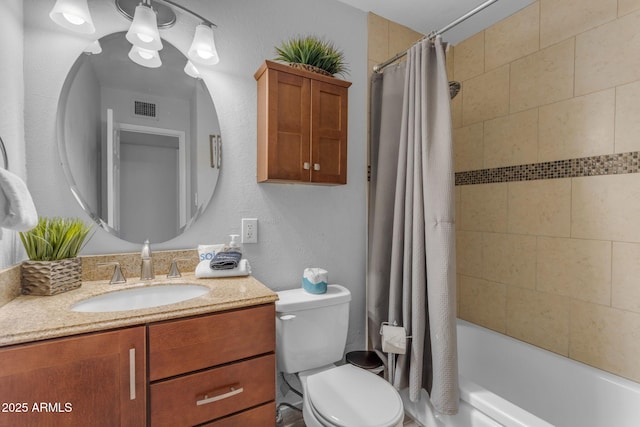 full bathroom featuring shower / tub combo, vanity, and toilet