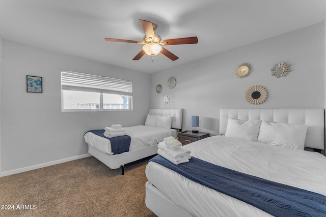 bedroom with ceiling fan and carpet floors