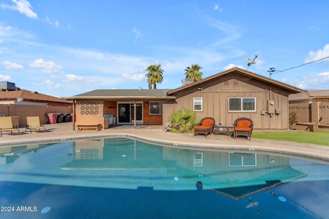 view of swimming pool featuring a patio