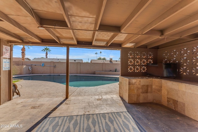 view of swimming pool featuring a patio area