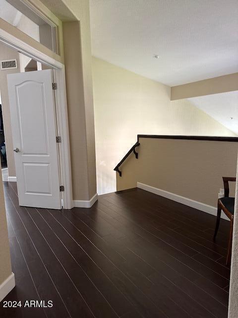 empty room featuring dark hardwood / wood-style flooring