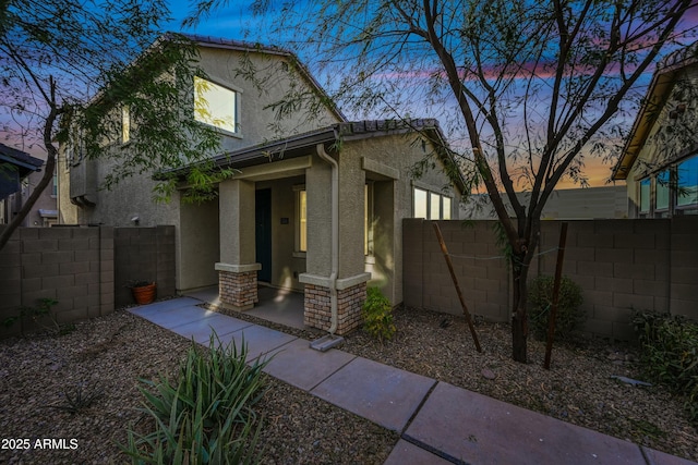 view of front of home featuring a patio