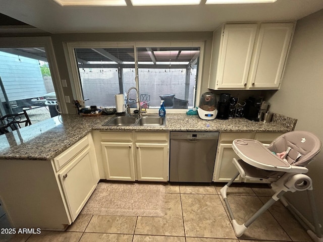 5143 W Mountain View Rd, Glendale, AZ 85302 - kitchen featuring dishwasher, a sink, stone counters, white cabinets, and a peninsula