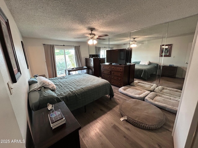 5143 W Mountain View Rd, Glendale, AZ 85302 - bedroom with wood finished floors and a textured ceiling