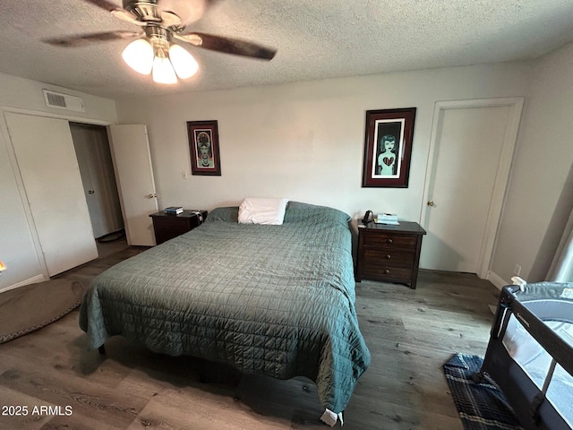 5143 W Mountain View Rd, Glendale, AZ 85302 - bedroom with a textured ceiling, wood finished floors, and a ceiling fan