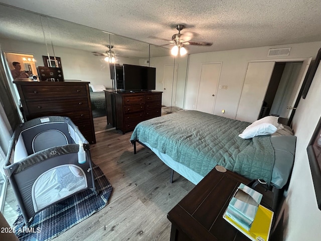 5143 W Mountain View Rd, Glendale, AZ 85302 - bedroom featuring wood finished floors, a textured ceiling, and a ceiling fan