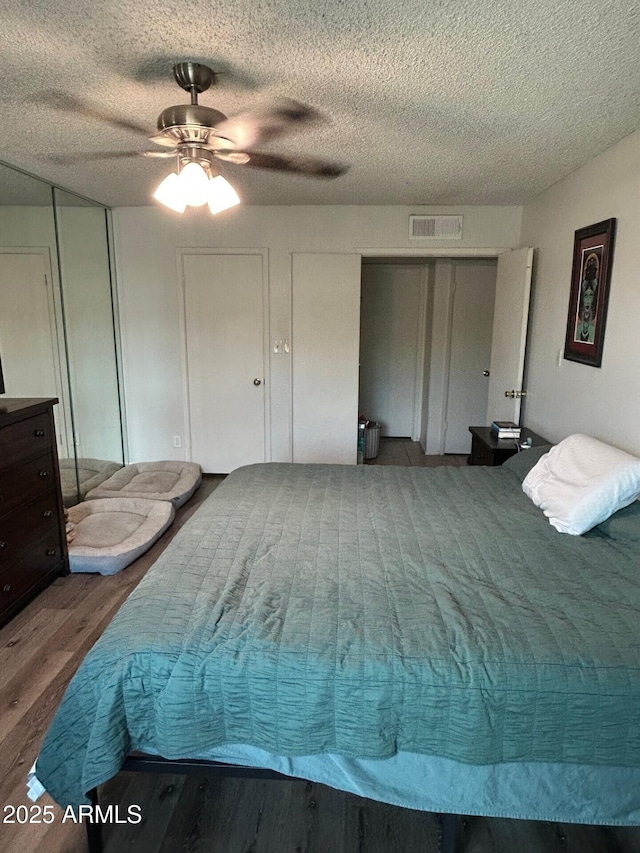 5143 W Mountain View Rd, Glendale, AZ 85302 - bedroom featuring wood finished floors, a textured ceiling, and ceiling fan