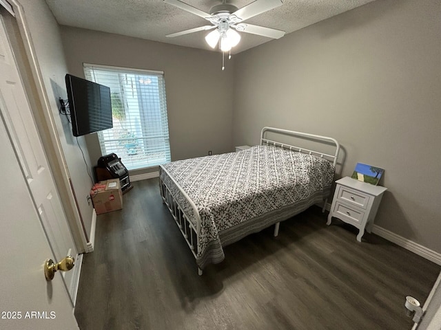 5143 W Mountain View Rd, Glendale, AZ 85302 - bedroom with dark wood finished floors, baseboards, a textured ceiling, and a ceiling fan