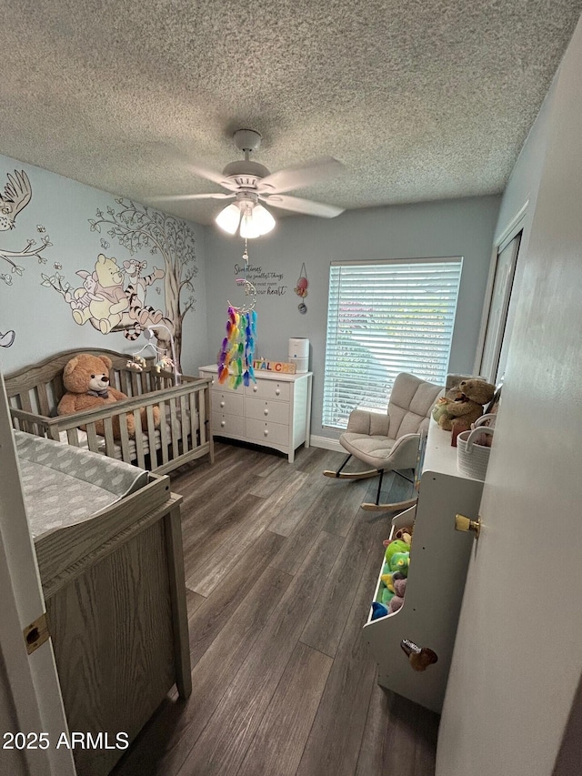5143 W Mountain View Rd, Glendale, AZ 85302 - bedroom with wood finished floors, a textured ceiling, a ceiling fan, and a closet