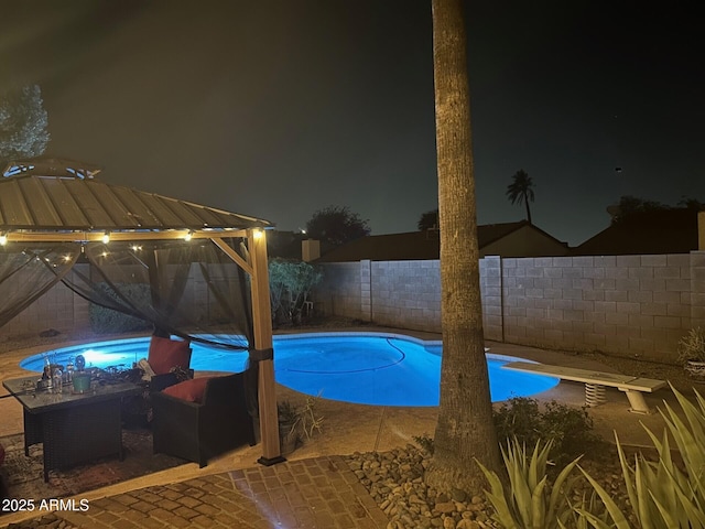 5143 W Mountain View Rd, Glendale, AZ 85302 - pool at twilight featuring a fenced backyard and a gazebo