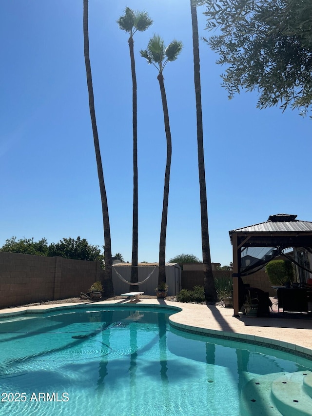 5143 W Mountain View Rd, Glendale, AZ 85302 - view of swimming pool with a gazebo, a fenced backyard, and a patio area